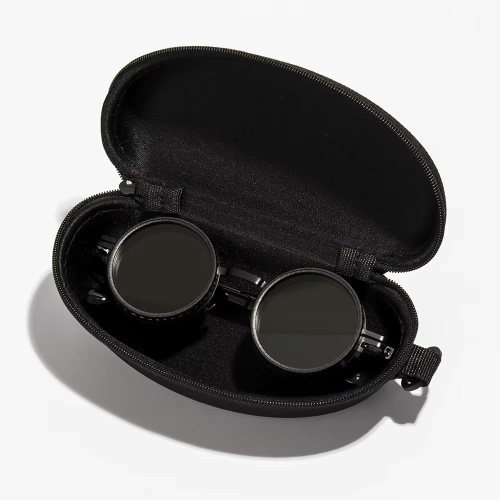 Black eyeglass case with a pair of black eyeglasses inside on a white background